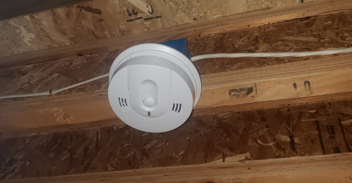 Smoke detector on exposed ceiling