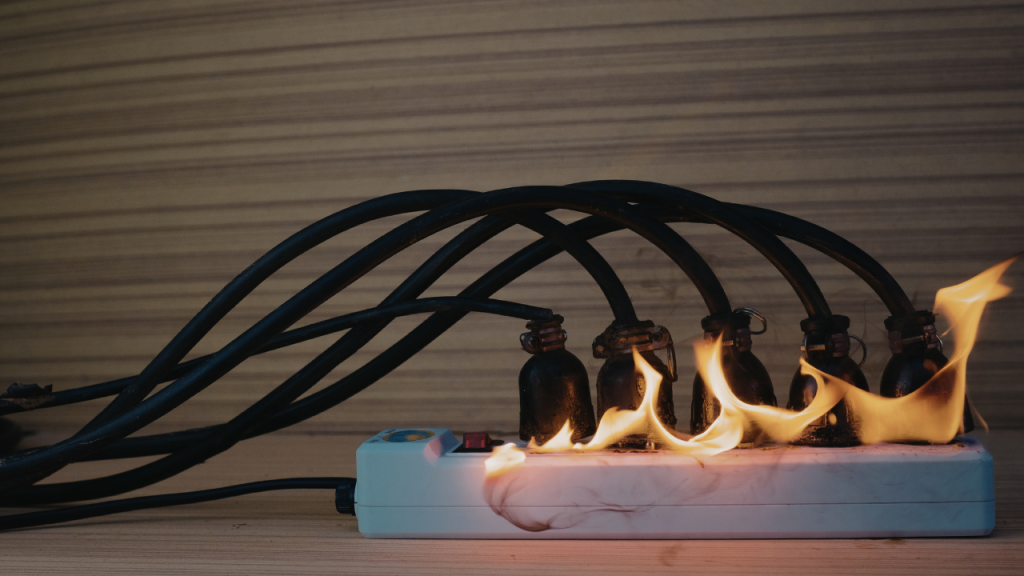 Overloaded extension cord on fire
